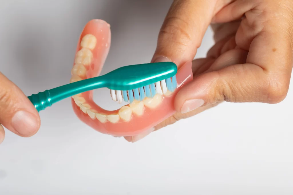 Proper care and cleaning of a removable dental prosthesis at home.