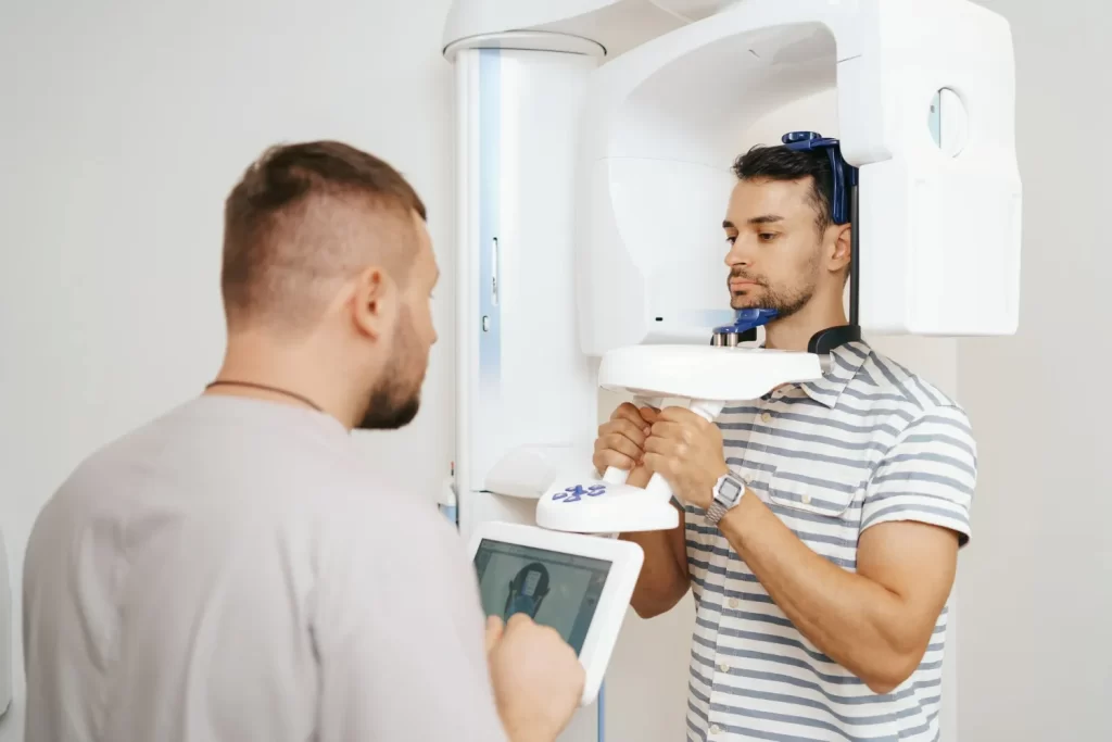 Dentist reviewing 3D CBCT scan for precise implant planning.
