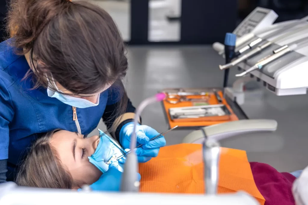 Rubber dam isolating a tooth to keep the area dry during the filling process.