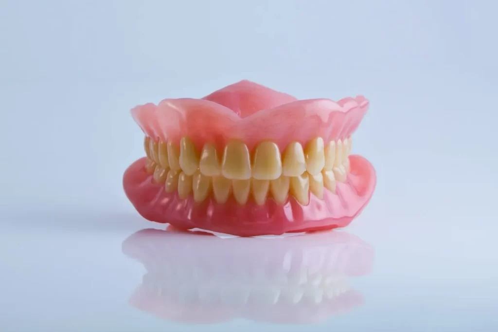 Full upper and lower dentures as an option to replace missing teeth instead of implants.