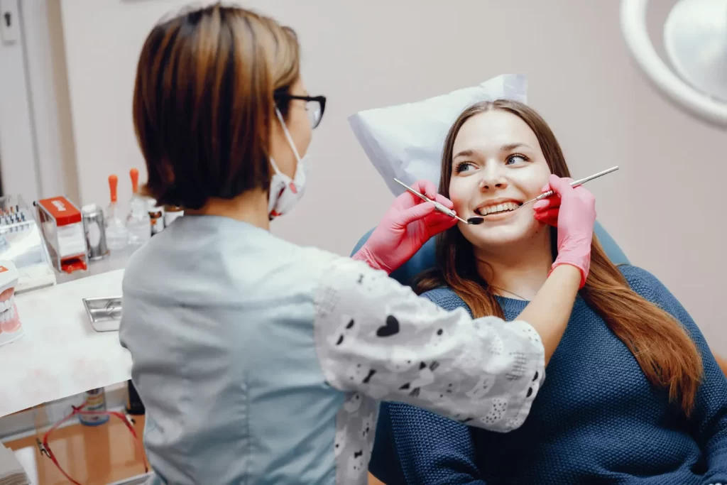 Clinical assessment during a cosmetic dentistry consultation in a dental clinic.